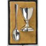 James Walker silver christening set with turret topped egg cup and associated silver spoon.
