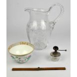 A large cut glass water jug, brandy glass, vinegar bottles and associated ceramics.