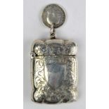 Serpentine form silver vesta case with vacant shield cartouche, Birmingham 1916