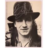 Bono signed 12 x 9.5 inch black and white print. Bono is an Irish singer-songwriter, activist,