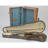 A leather case, a Violin and bow in case.