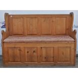 A pine pew 121 cm long x 36 cm deep x 90 cm high.