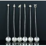 Set of six oriental sterling silver cocktail spoons each with a different finial.