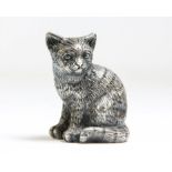 Silver covered model of a seated cat.