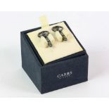 Novelty cased pair of silver cufflinks in the form of steering wheels by Carrs.