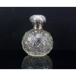 Edwardian silver topped cut glass bulbous bodied perfume bottle, London 1903.