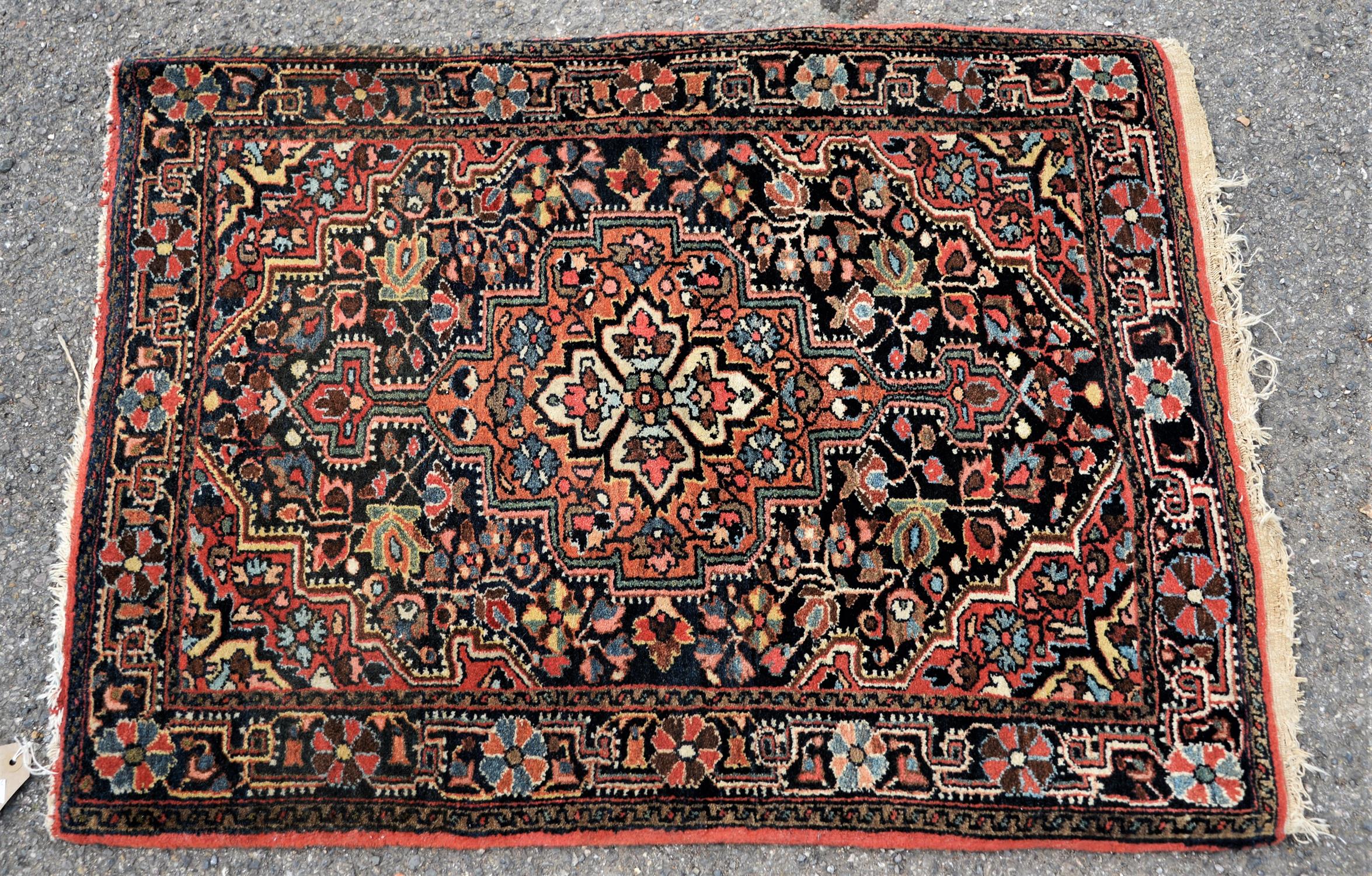 Small Persian mat or rug, 20th Century, central stepped motif, with central floral design,