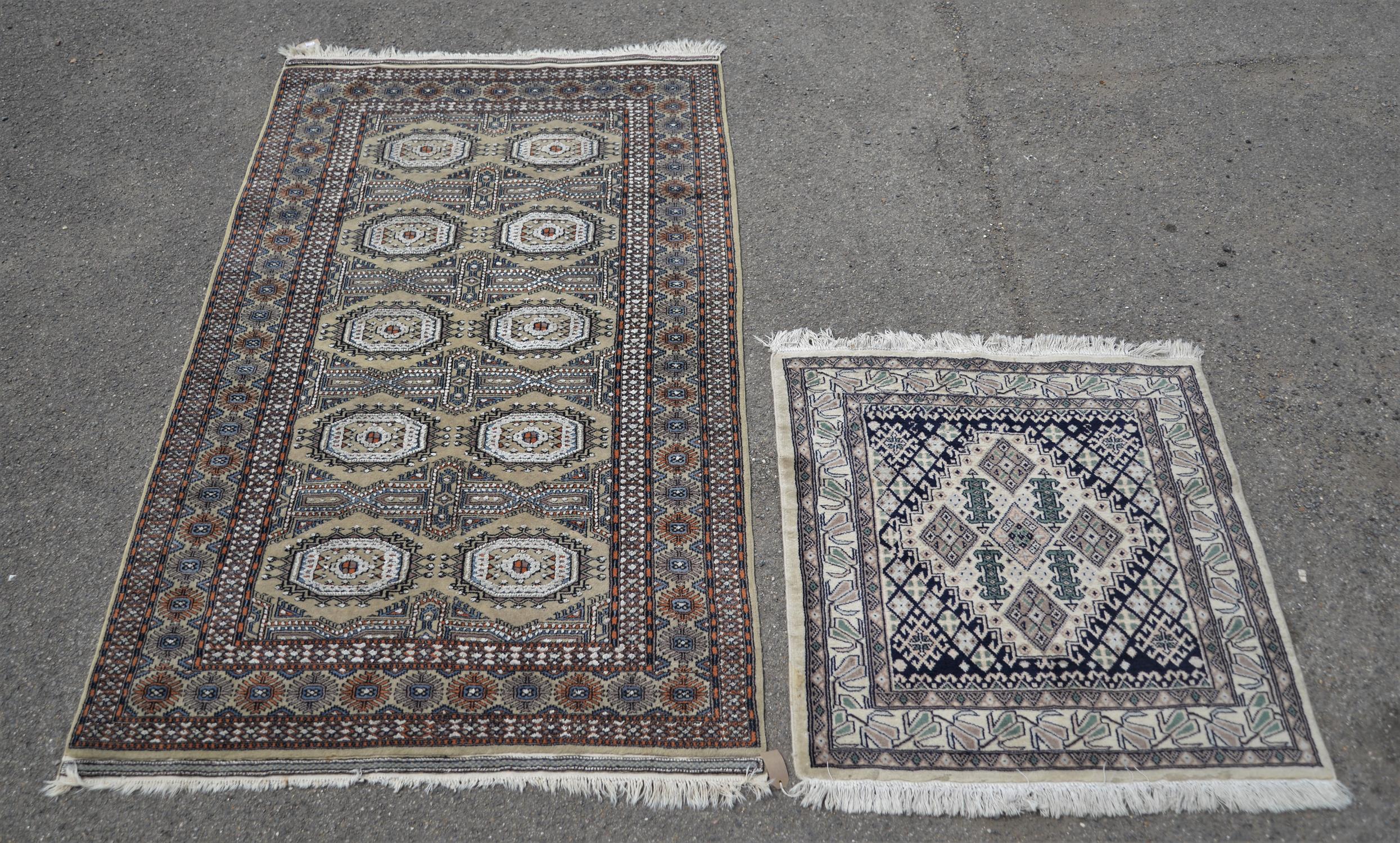 Persian rug, 20th Century, woven with eight octagonal hooked lozenges, within borders,