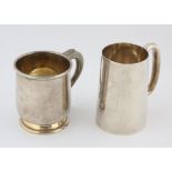 Two modern silver mugs with engraved initials, Birmingham 1969, Sheffield 1951, 21oz 656gm.