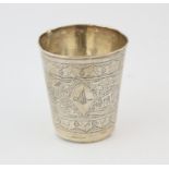 Persian silver beaker engraved with a Mosque and scrolling decoration, two stamped marks to the rim,