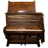 A walnut case upright piano by E Nicholls, Maesycwmmer, Upright Grand Trichord, retailed by E.