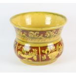 Mary Wondrausch, yellow and brown glazed bowl, with reserve panels of flowers and with a motto to