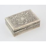 Edward VII silver stamp box by William Comyns & Sons, embossed with cherubs amongst foliate scrolls,