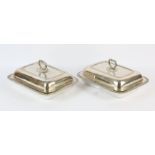 Pair of George III silver entrée dishes with covers, gadrooned rims and foliate handles by Joseph