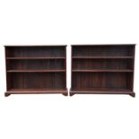 A pair of African hardwood bookcases by Rail Antiques, with three shelves and slatted sides,