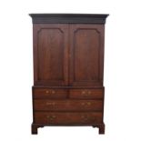 A mahogany linen press, 19th Century, with fluted cornice above two panelled doors,