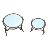 Two bleached mahogany oval swing framed mirrors, late 19th/early 20th Century, of graduated size,