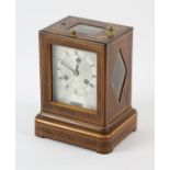 French rosewood veneered campaign clock with boxwood marquetry inlay, the silvered dial signed C. F.