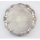 Modern silver salver with pie crust border on foliate scroll feet by Viner's Ltd , Sheffield 1962,