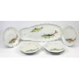 Porcelaine de Sologne fish service comprising a serving dish 55.5cm and six shell shaped plates