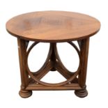 After Sir Edwin Lutyens. A circular table, the plain top over a triangular base featuring open