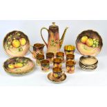 Hand painted coffee set decorated with fruit and with gilt interiors comprising, coffee pot,