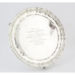George V silver presentation salver with pie crust border on foliate C-scroll feet by Gladwin Ltd.