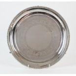 Victorian silver waiter with foliate engraved decoration and gadrooned rim by Henry Manton