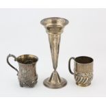 Victorian embossed silver christening mug, London 1865, another christening mug, London 1903 and a