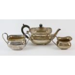 George V three piece silver tea service of compressed oval form by Stokes & Ireland Ltd,