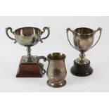 Two silver trophy cups and a mug, various dates and makers. 18oz 565gm