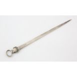 Early George III silver meat skewer with shell and ring terminal and Griffins head crest,