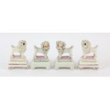 Two pairs of Staffordshire pottery poodles, 19th Century, 11cm high (4)