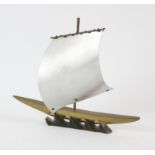 A small sculpture of a J class Yacht signed indistinctly.