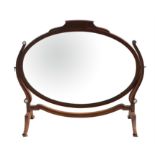 Oval mahogany dressing table mirror on splay supports, inset with ivorine roundels, W76 x D28.