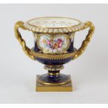 Royal Worcester porcelain urn, 20th Century, painted with reserves of flowers within gilt frames,