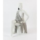 Lladro porcelain figure of a seated girl, with a silver rose strewn shawl, printed marks to base,