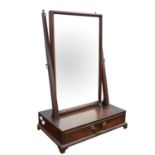 A mahogany toilet mirror, 19th Century, with rectangular bevelled plate, the plain uprights with