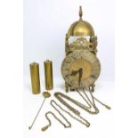 A brass cased lantern clock the German weight driven movement striking the hours and half hours on