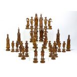 19th century South German linden or lime wood chess set, carved and raised on socle bases,