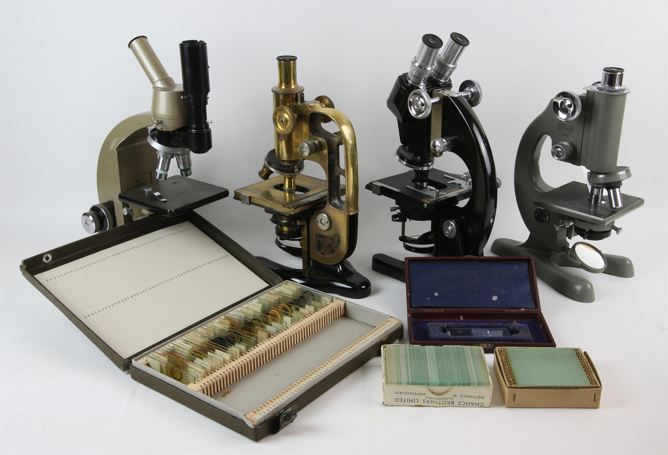 Four microscopes to include C Baker microscope with four objectives, binocular and monocular