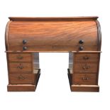 Late victorian mahogany cylinder desk, the roll top with fitted interior over two pedestals each