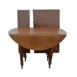 19th century mahogany dining table the oval top extending to receive two leaves on tapering reeded