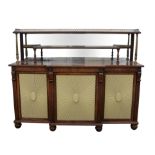 George IV/ Regency breakfront rosewood side board, the upper section of two galleried shelves with