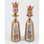 Pair of Bohemian glass decanters, late 19th Century, decorated with panels of flowers on white