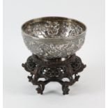 A Chinese silver bowl with maker's marks for Woshing Shanghai; the exterior decorated with birds