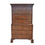 19th century mahogany chest on chest with dentil corners over a blind fret freeze,