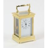 A French polished brass carriage time piece, 20th Century, by L' Epee, the white enamel dial with