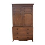 George III oak linen press, with dentil moulded top above crossbanded and panelled doors,
