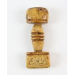 A scrimshaw whale bone seam press, 19th Century, dated 1833, with the initials E A L carved to the